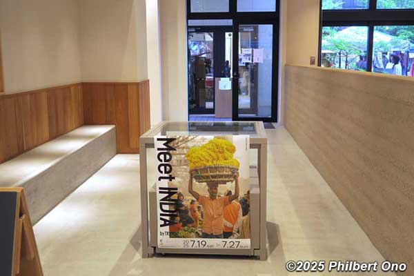 Corridor to the bookstore decorated with Meet India poster.